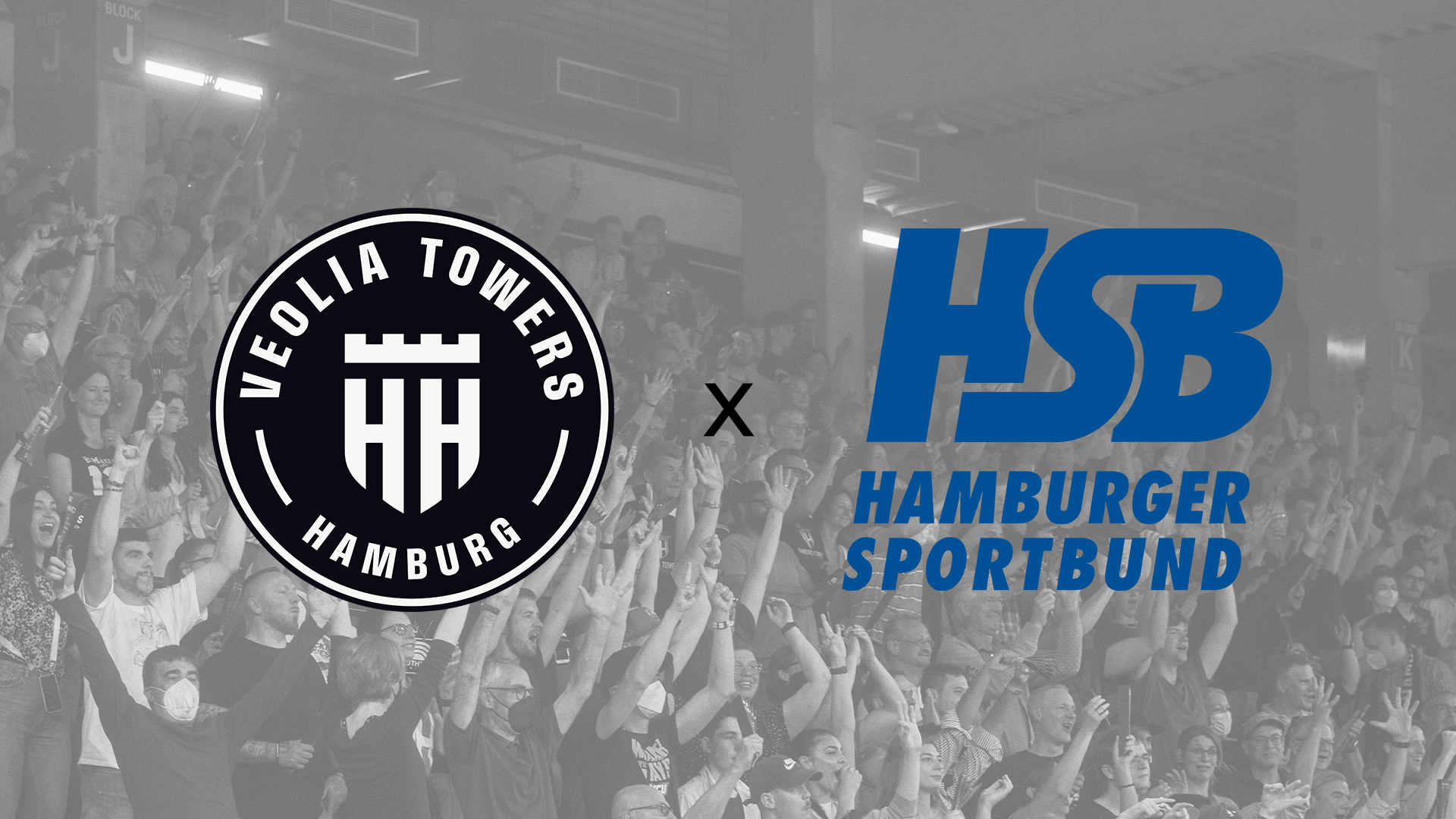 Logos der Veolia Towers Hamburg und des Hamburger Sportbunds vor einem jubelnden Publikum im Hintergrund